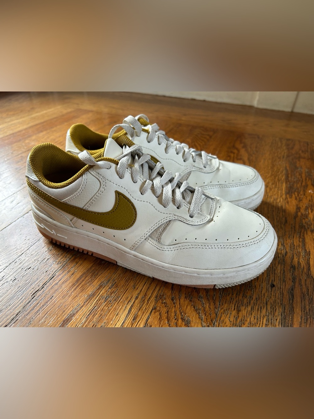 Nike Men’s Low-Top Sneakers in White with Olive Swoosh